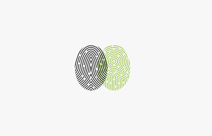 Two overlapping fingerprints, black and green.