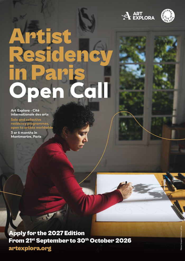 Text of the call with a photo of a person working at a desk with a window behind them. 