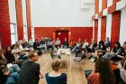 People sitting in a large circle. 