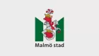 Heraldic crest for the city of Malmö - two crowned griffin heads stacked on top of each other separated by a knight's helmet.