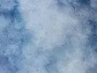 White clouds in a blue sky. 