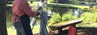 A person painting outside. 