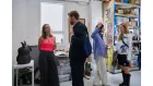 People standing in a creative office space. 