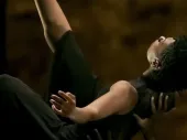A person being held in the horizontal. 