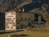 A multi-story building in the high mountains. 