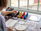 View from behind of a person painting. 