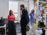 People standing in a creative office space. 