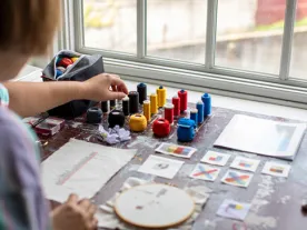 View from behind of a person painting. 